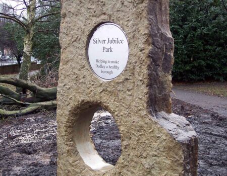 Horsham holed stone with plaque
