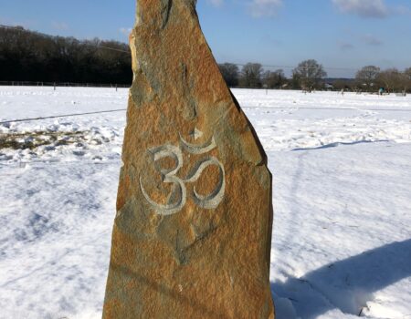 Hand carved Om symbol on Welsh Pennant stone