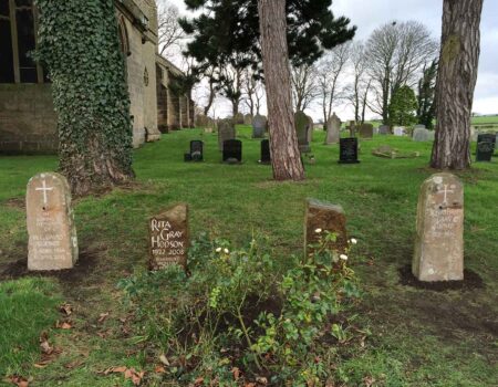 Four natural headstones celebrating a single family