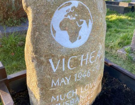 Preseli Bluestone headstone, personalised with a globe for a keen traveller