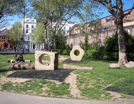 Holed stones of Horsham Sandstone in a play area in a Notting Hill Square, London