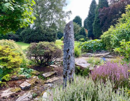 Cornish granite needle stone in a sunken garden