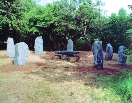 Stone circle of green striped slate with a central stone table